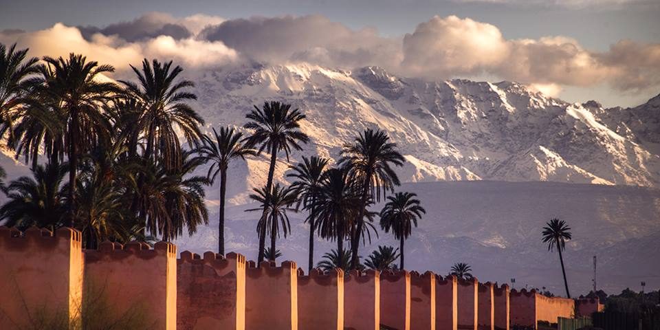 Family enjoying luxury activities in Marrakech with Atlas Mountain views